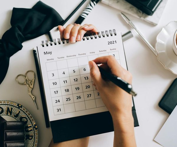 A calendar with circled dates representing a consistent habit.